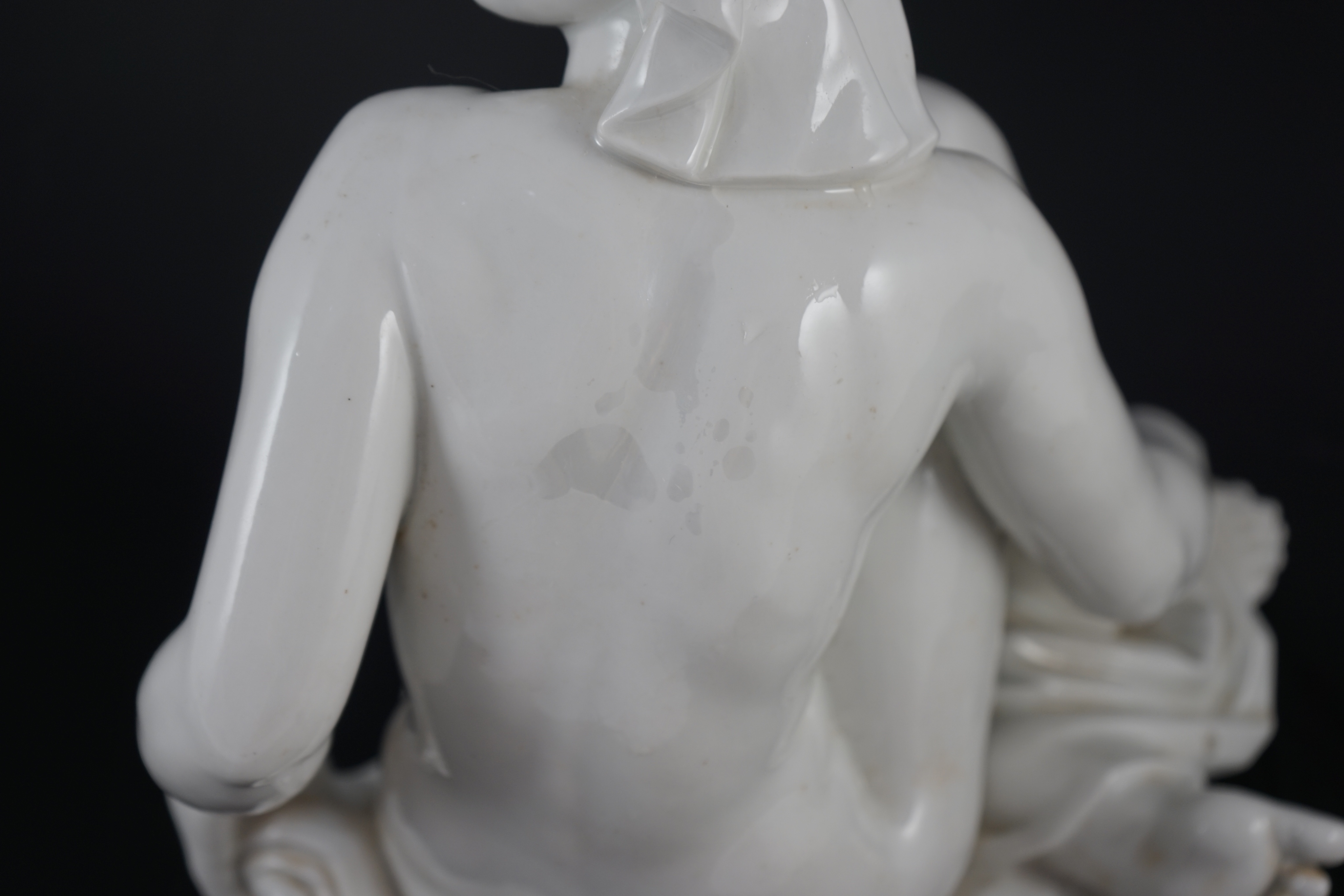 Robert Ullmann (1903-1966) for Meissen, a white glazed porcelain figure of a seated female nude, 31.5cm high